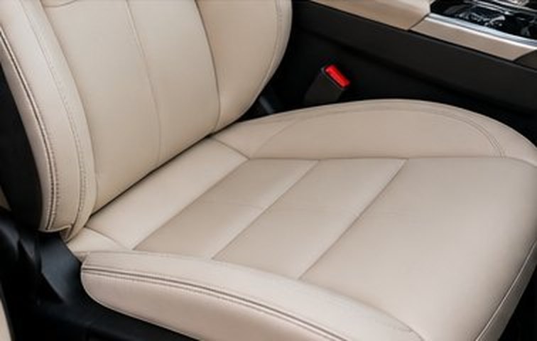 Stained cream leather seat, after